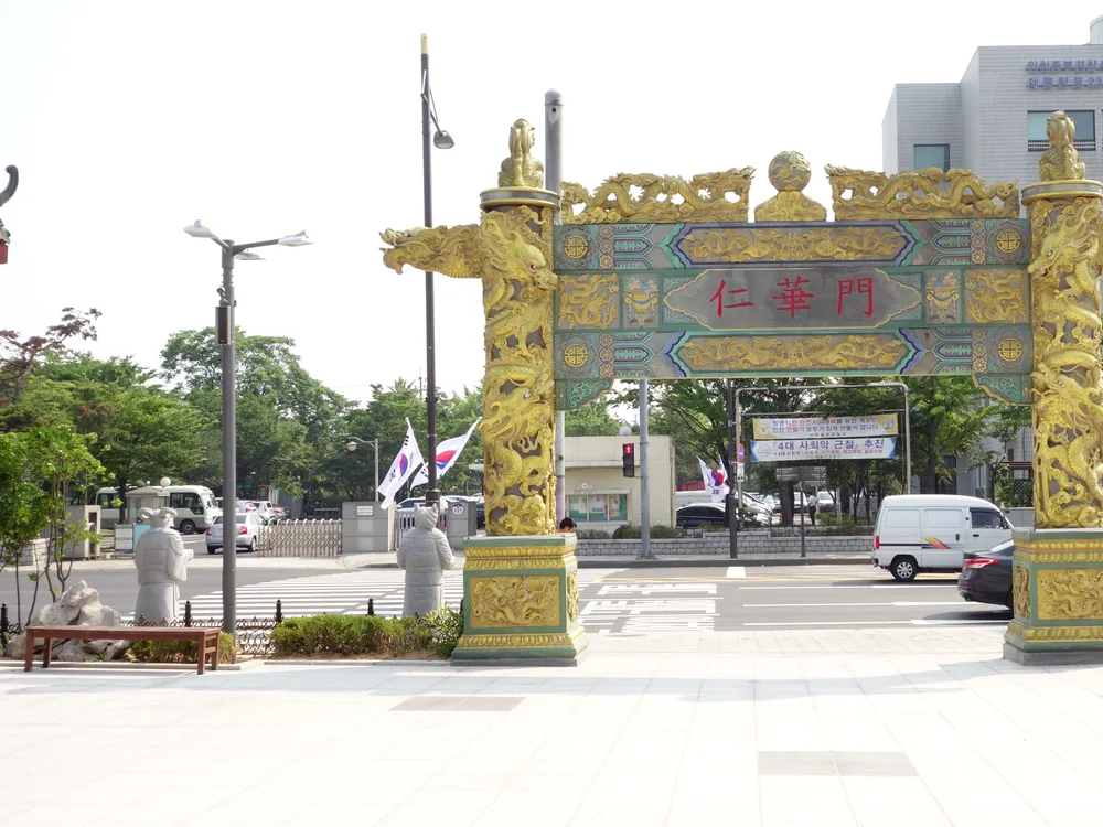 The ornate gold-and-green painted paifang gate marking the entrance to Incheon Chinatown